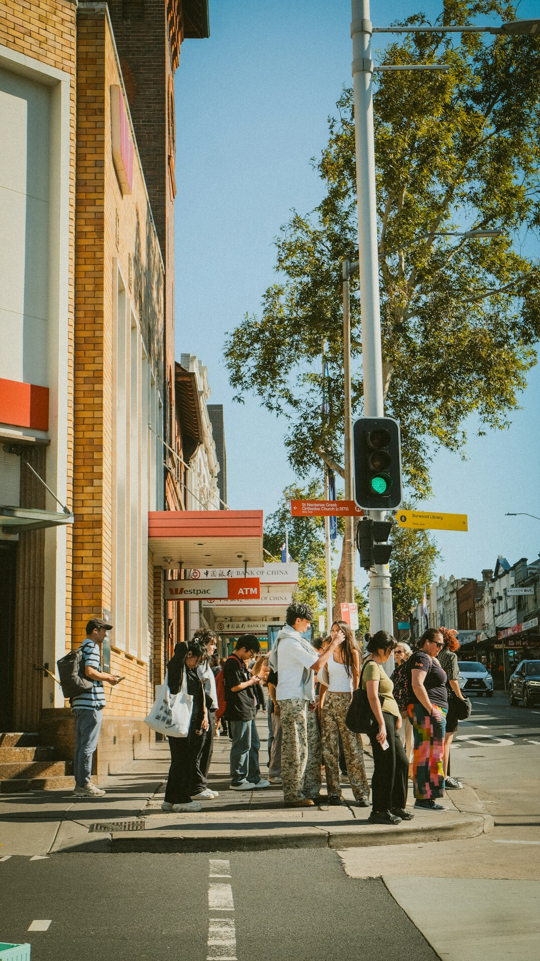 Neighbors gathered together on a street corner during a local community event